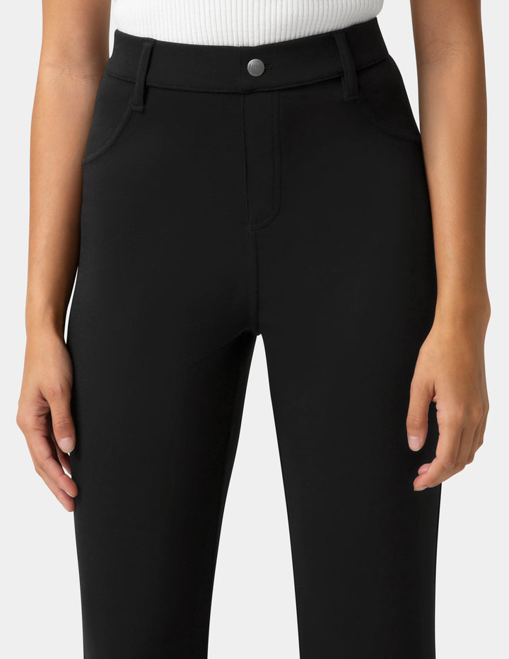 Black pants worn by a person on a white background