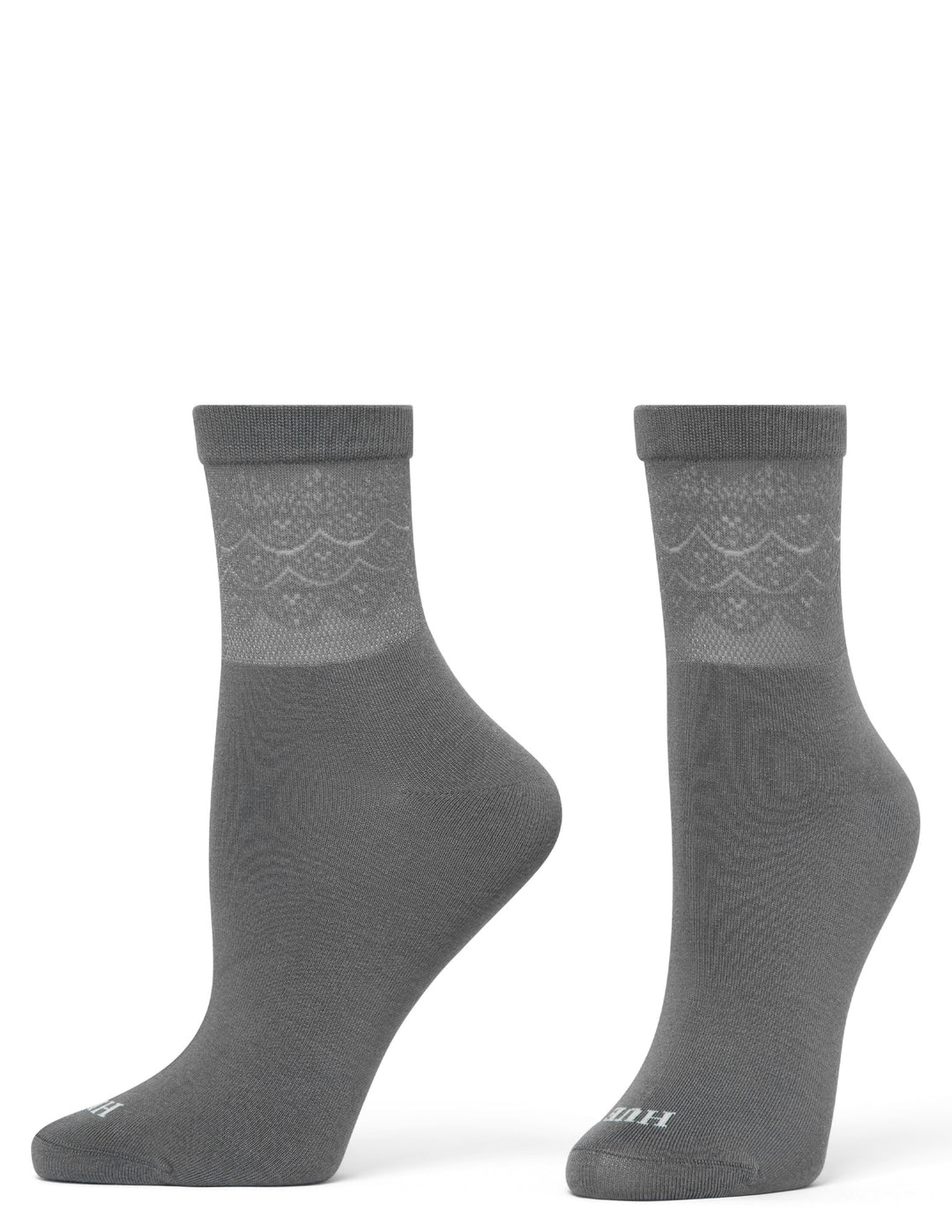 Pair of gray socks with a subtle pattern on a white background