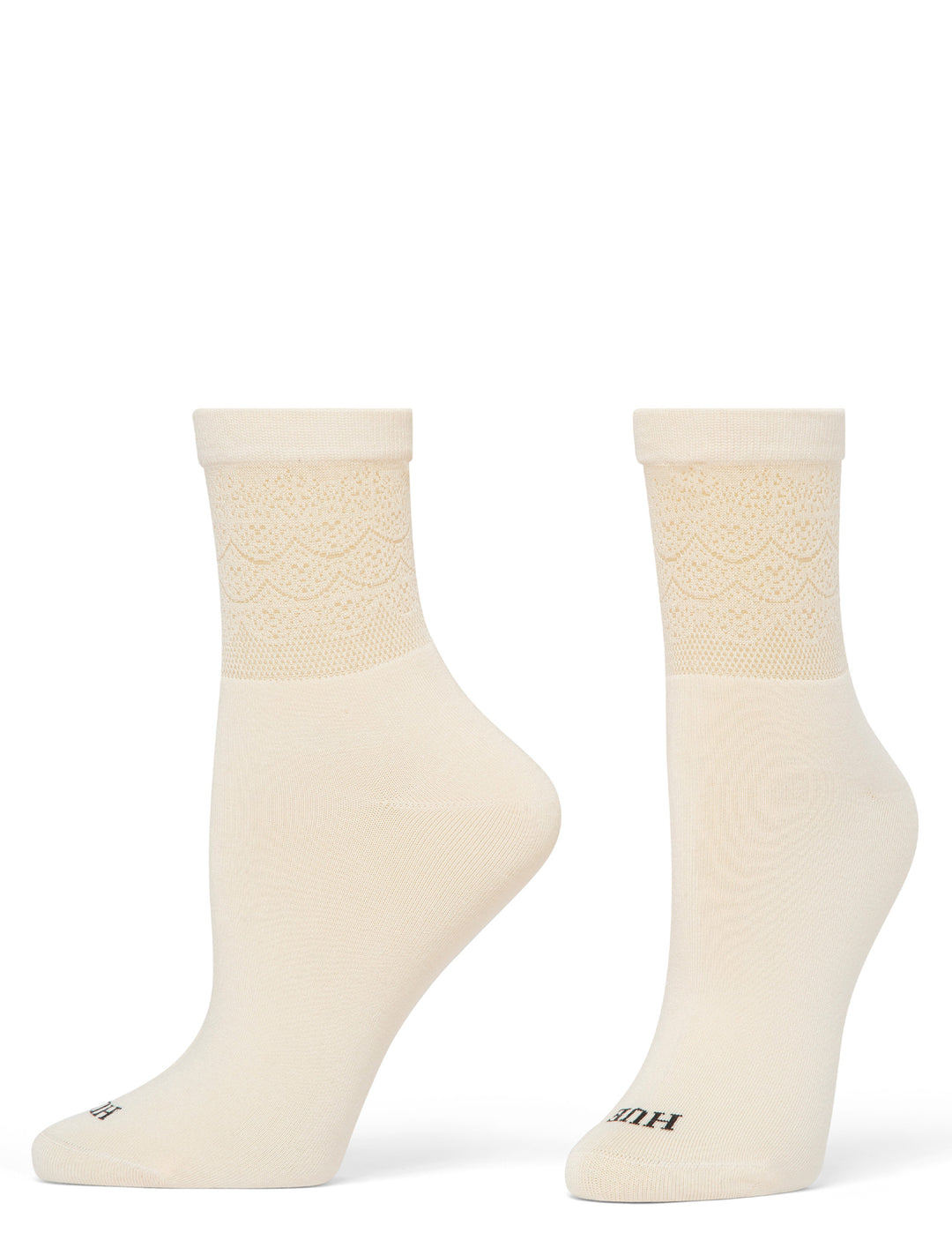Pair of cream-colored socks with textured pattern on a white background