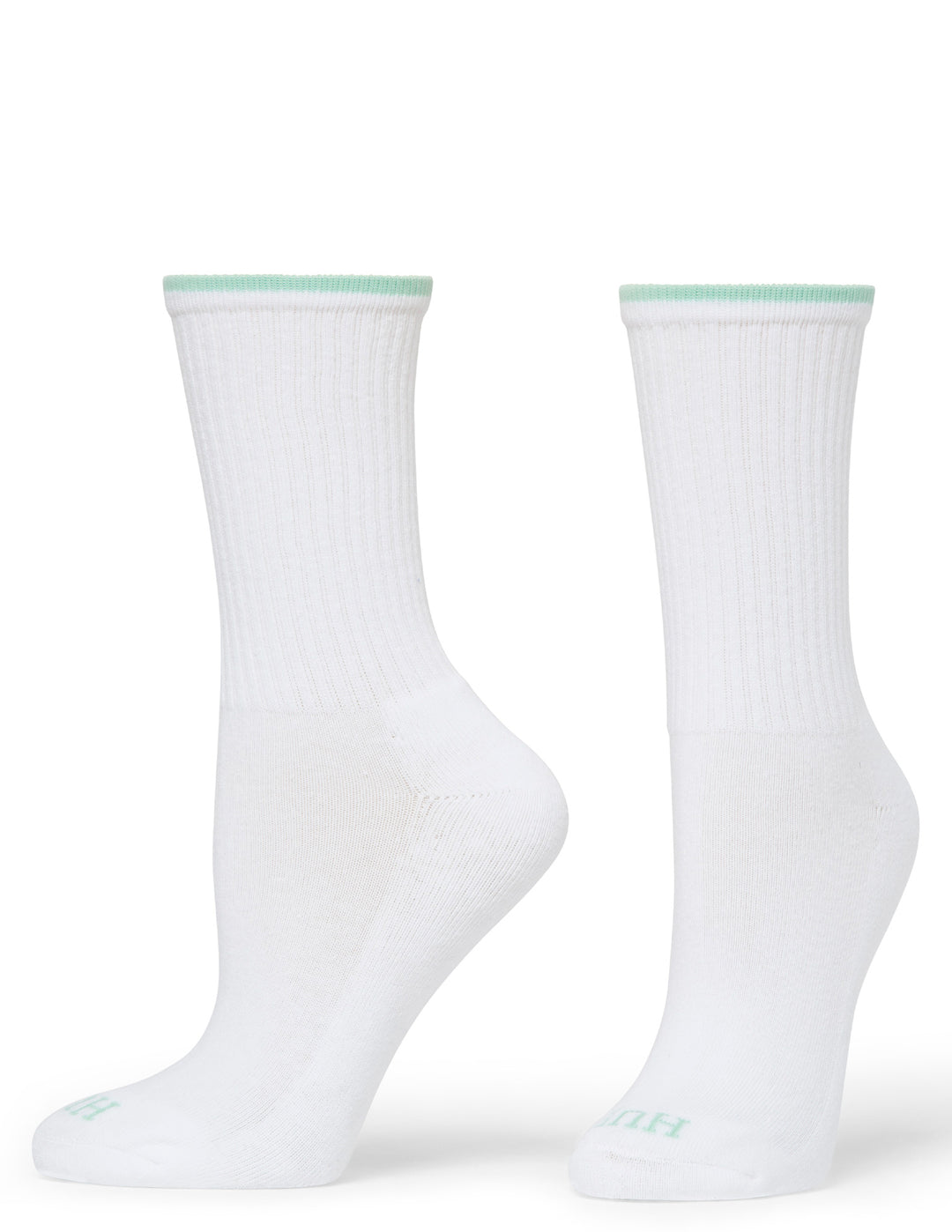 Two white socks with green accents on a white background