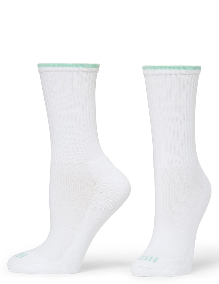 Two white socks with green accents on a white background