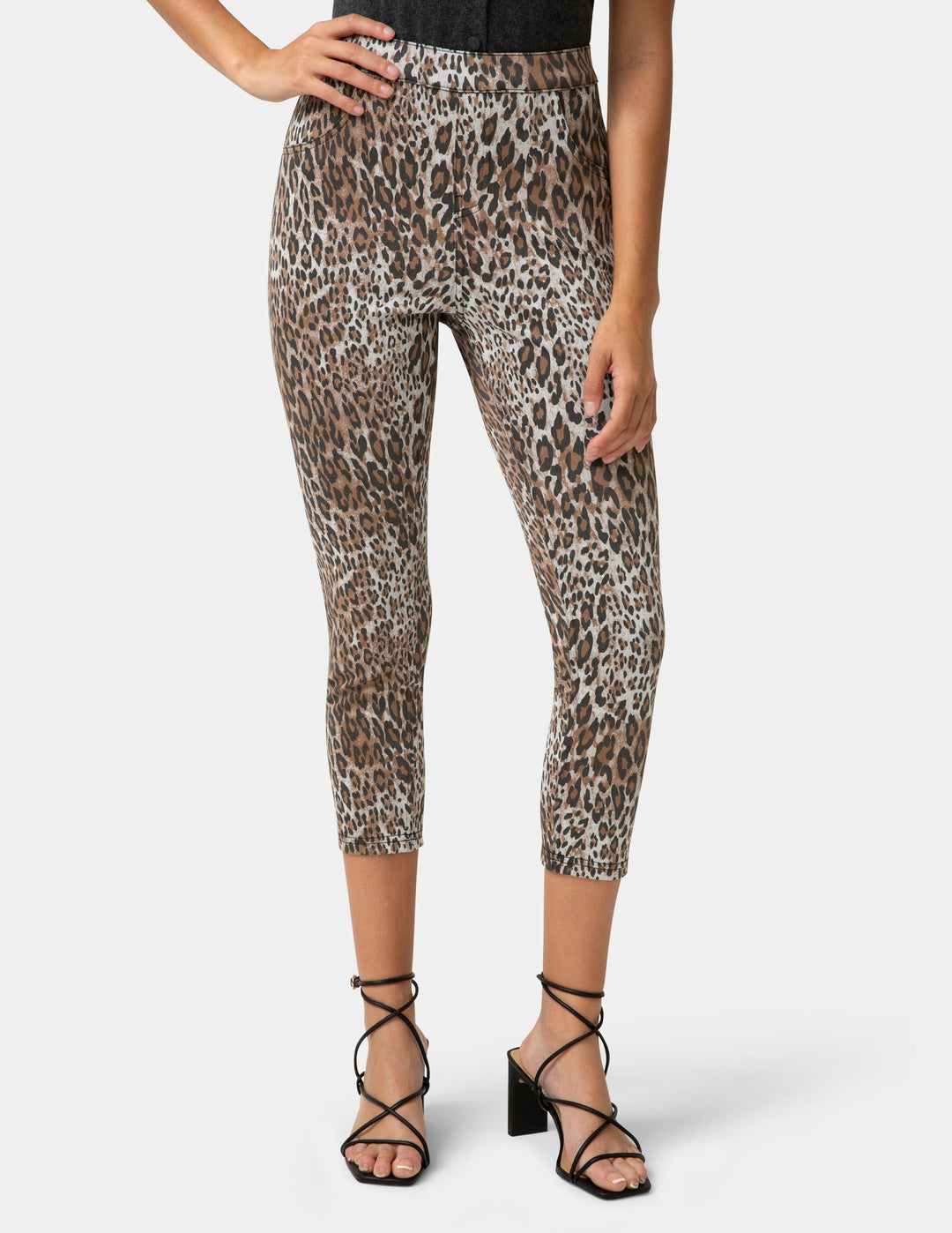 Leopard print pants worn by a person on a white background