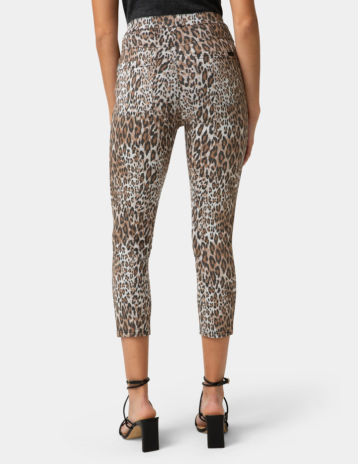 Leopard print pants worn by a person on a white background