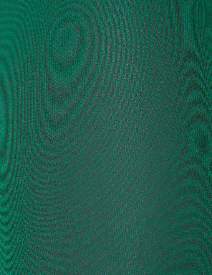 A close-up of a solid dark green textured fabric surface.