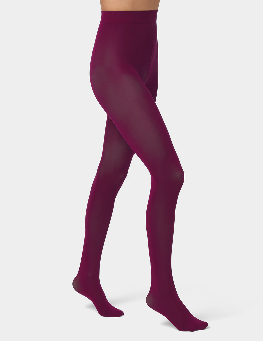 A model's legs wearing sheer, high-waisted tights in an eggplant color, shown from the waist down against a light gray studio background.