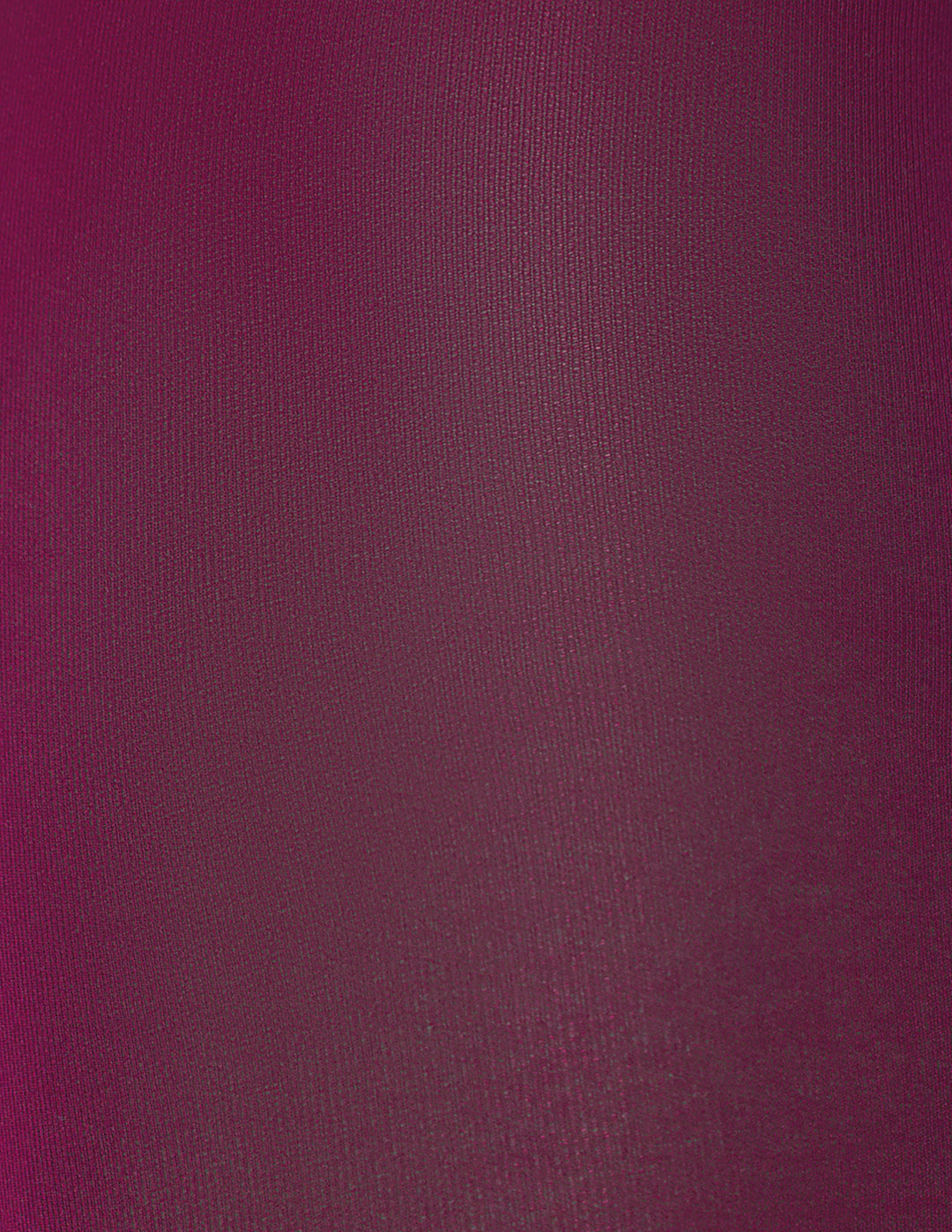 A close-up of a textured fabric in an eggplant purple color.