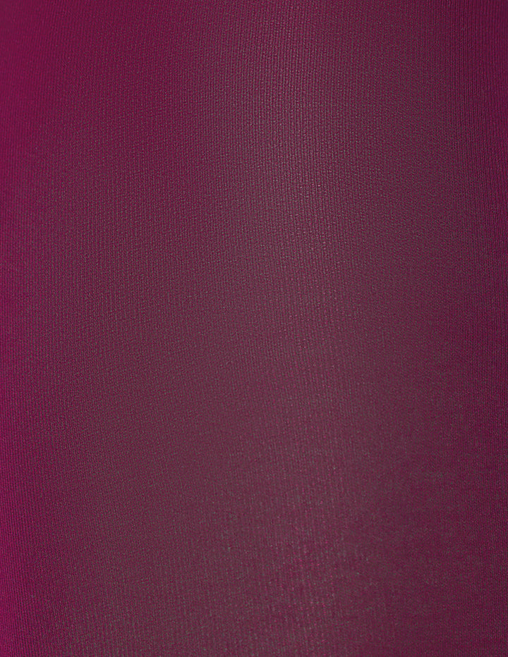 A close-up of a textured fabric in an eggplant purple color.