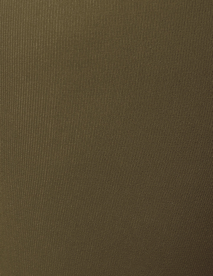 A close-up of a textured olive green fabric.