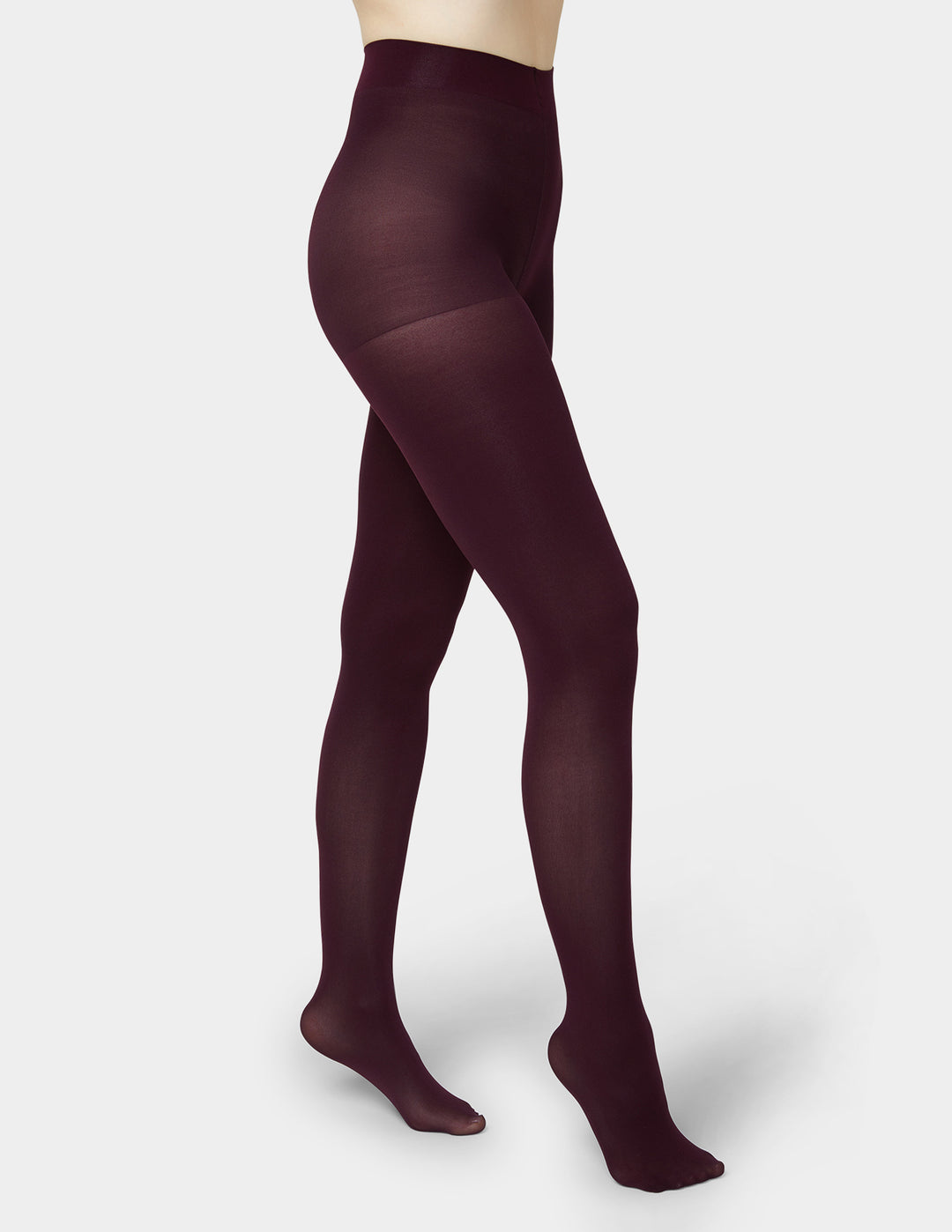 Maroon tights worn by a mannequin on a white background