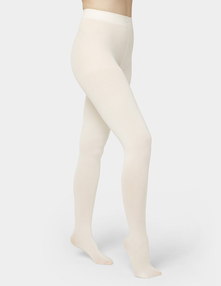 Beige tights worn by a person on a white background