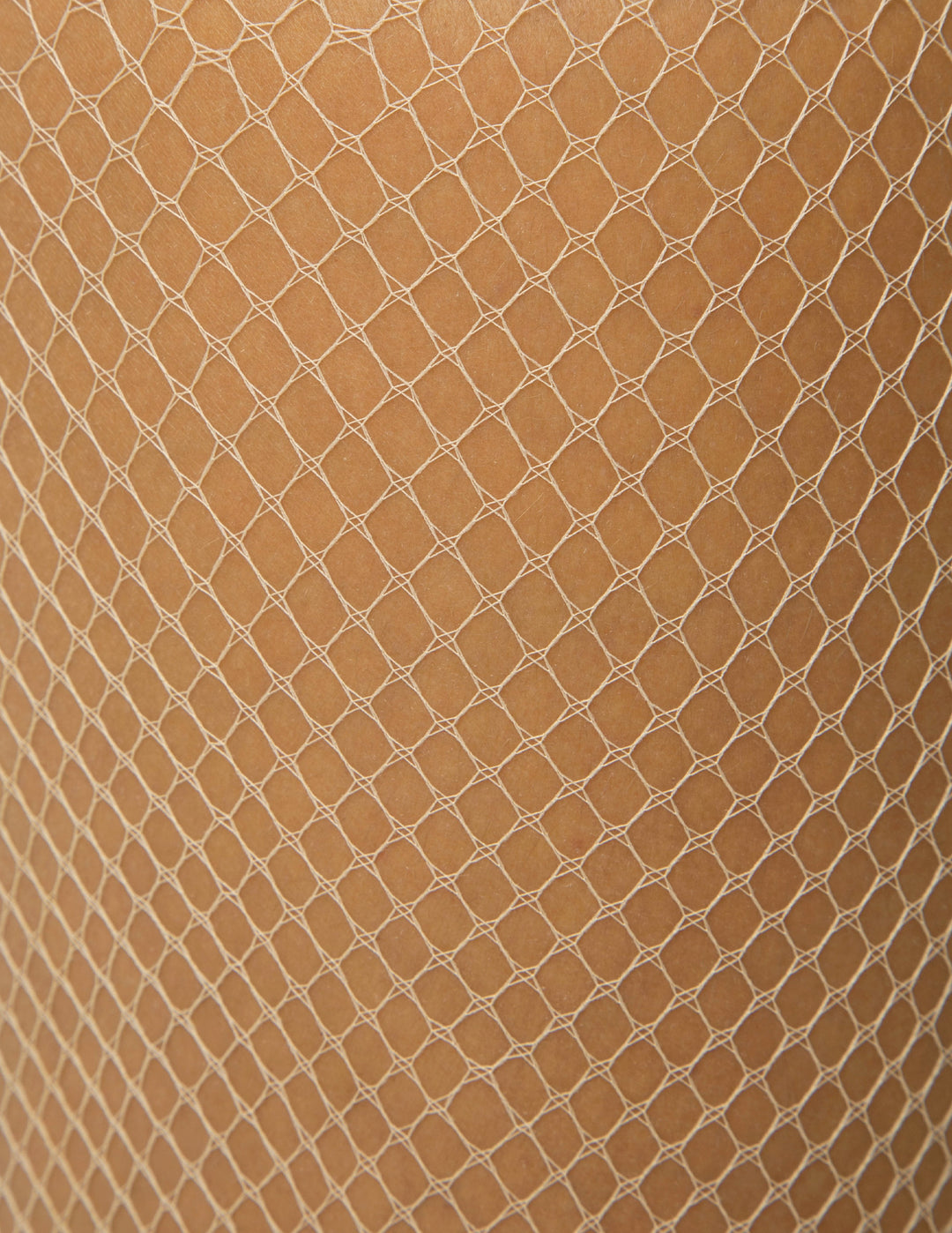 Close-up of beige fishnet fabric with a diamond pattern
